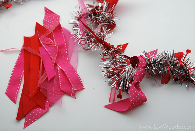 Tinsel garden with cut pink and red ribbon scraps.