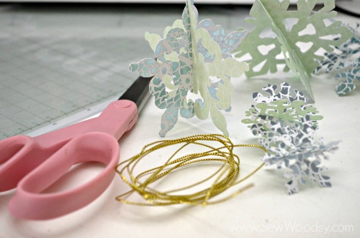 Die-Cut Snow Flake Ornaments using the @Cricut from SewWoodsy.com