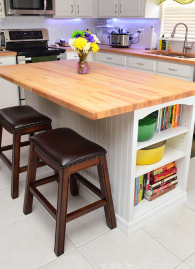 Interior kitchen with a wood island in the middle