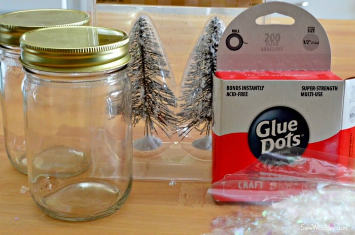 Supplies: two mason jars, wire bottle brush trees, glue dots, and fake snow.