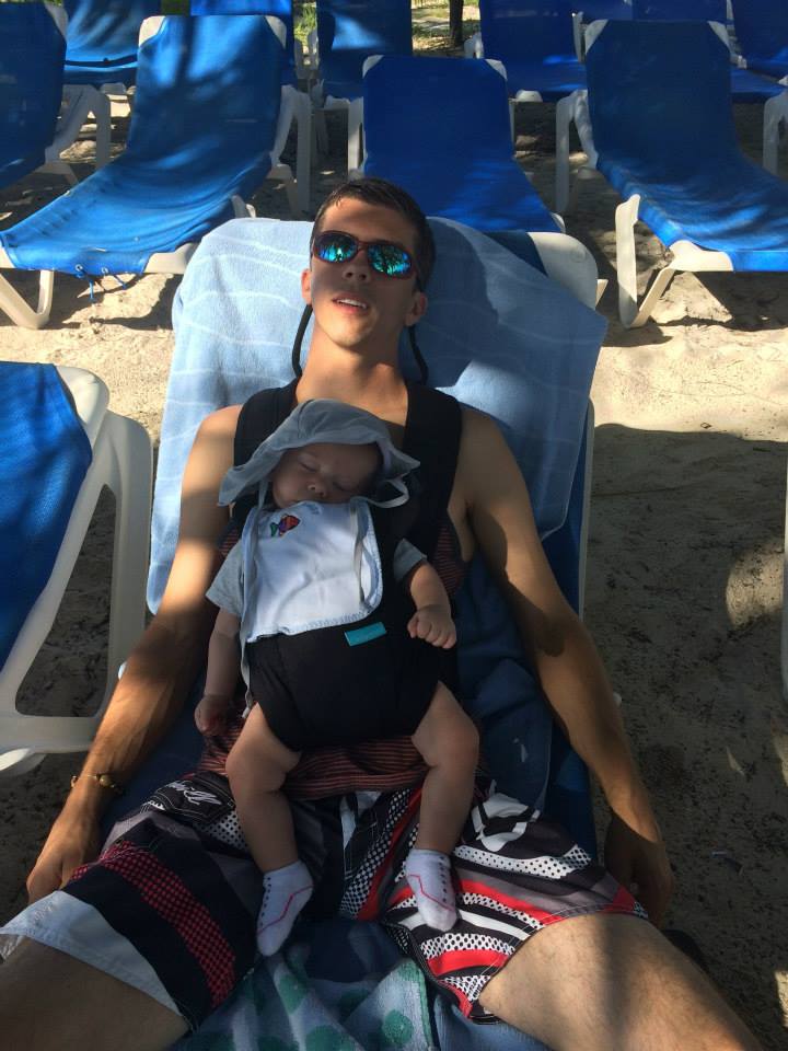 Cruising with an Infant - baby wearing on beach