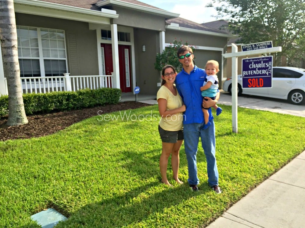 Family in front of first home