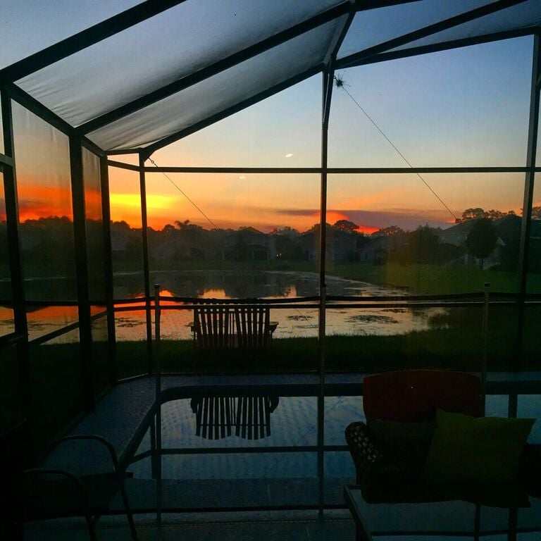 orange sunrise at florida pool home