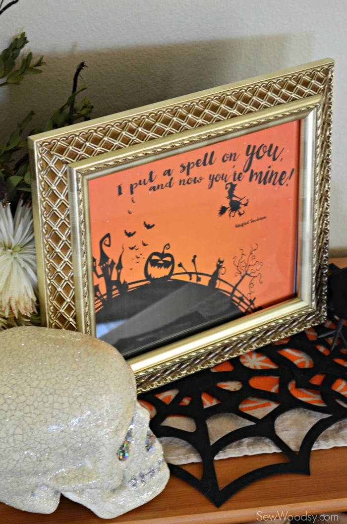 Gold frame with an orange printable that reads "I put a spell on you".