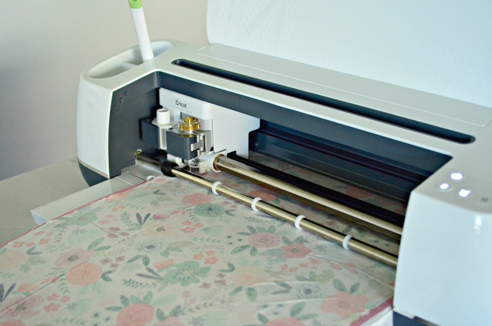White Cricut Maker Cutting Fabric