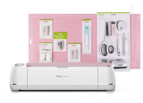 Pink Cricut Maker plus sewing tools and extra blades with pink mat.