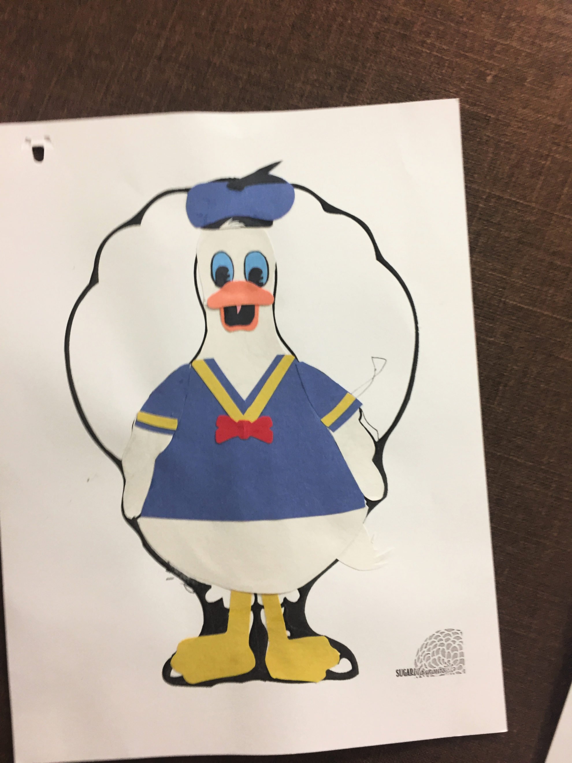 Paper Turkey In Disguise dressed as Donald Duck with construction paper clothing.