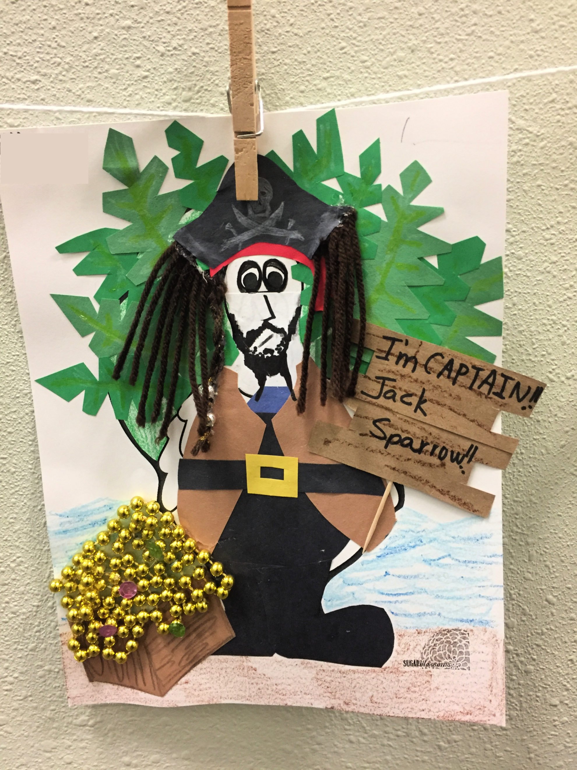 Paper Turkey In Disguise dressed as Jack Sparrow with yarn hair, construction paper clothing, and beads for treasure.