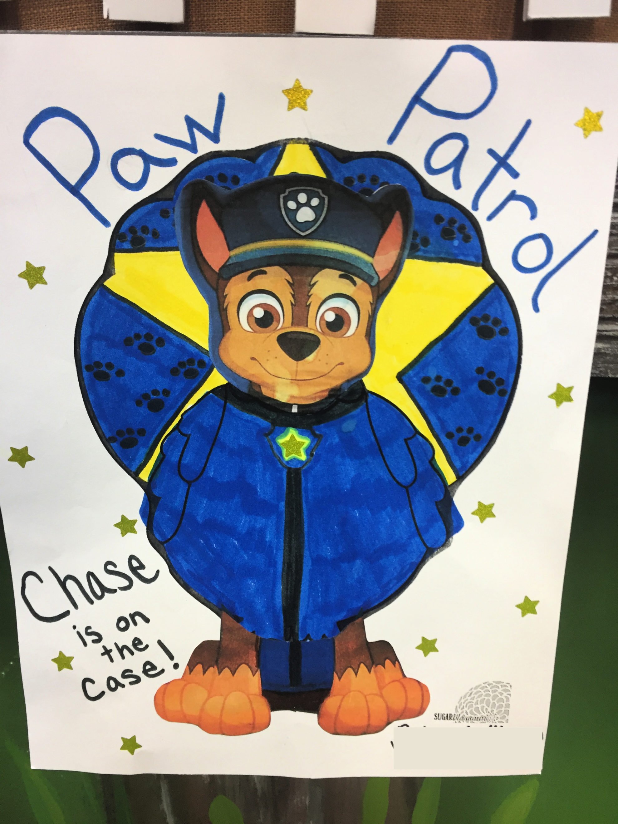 Chase from Paw Patrol dressed as a Turkey In Disguise with the words "paw patrol" written on top.