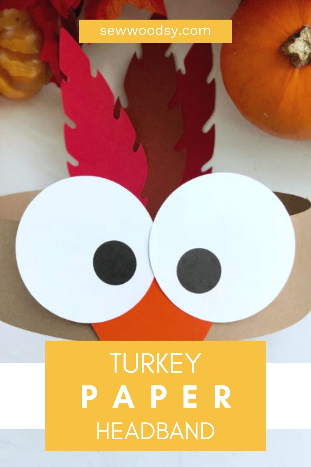 Up close of a turkey paper craft with text on image for Pinterest.