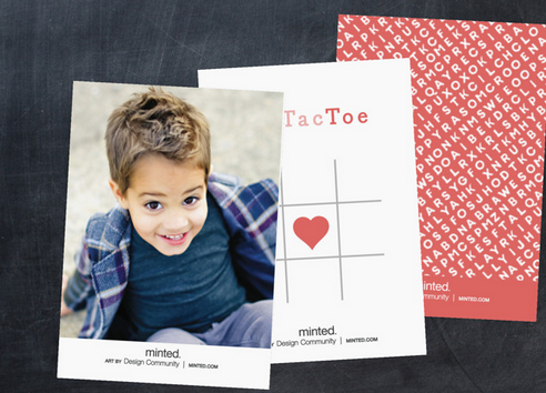 Photo of a little boy with a tic tac toe board on the front of the card.