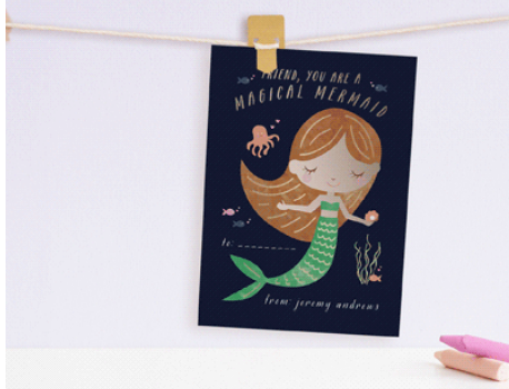 Mermaid with brown hair and green tail that says "magical mermaid" on the card.