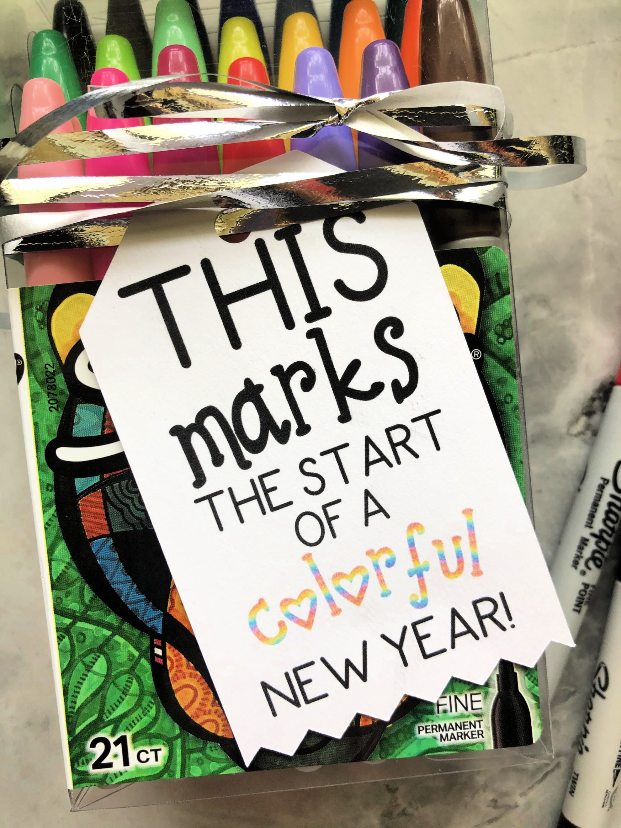 Close up of a sharpie bag with a tag that reads "This marks the start of a colorful new year"!