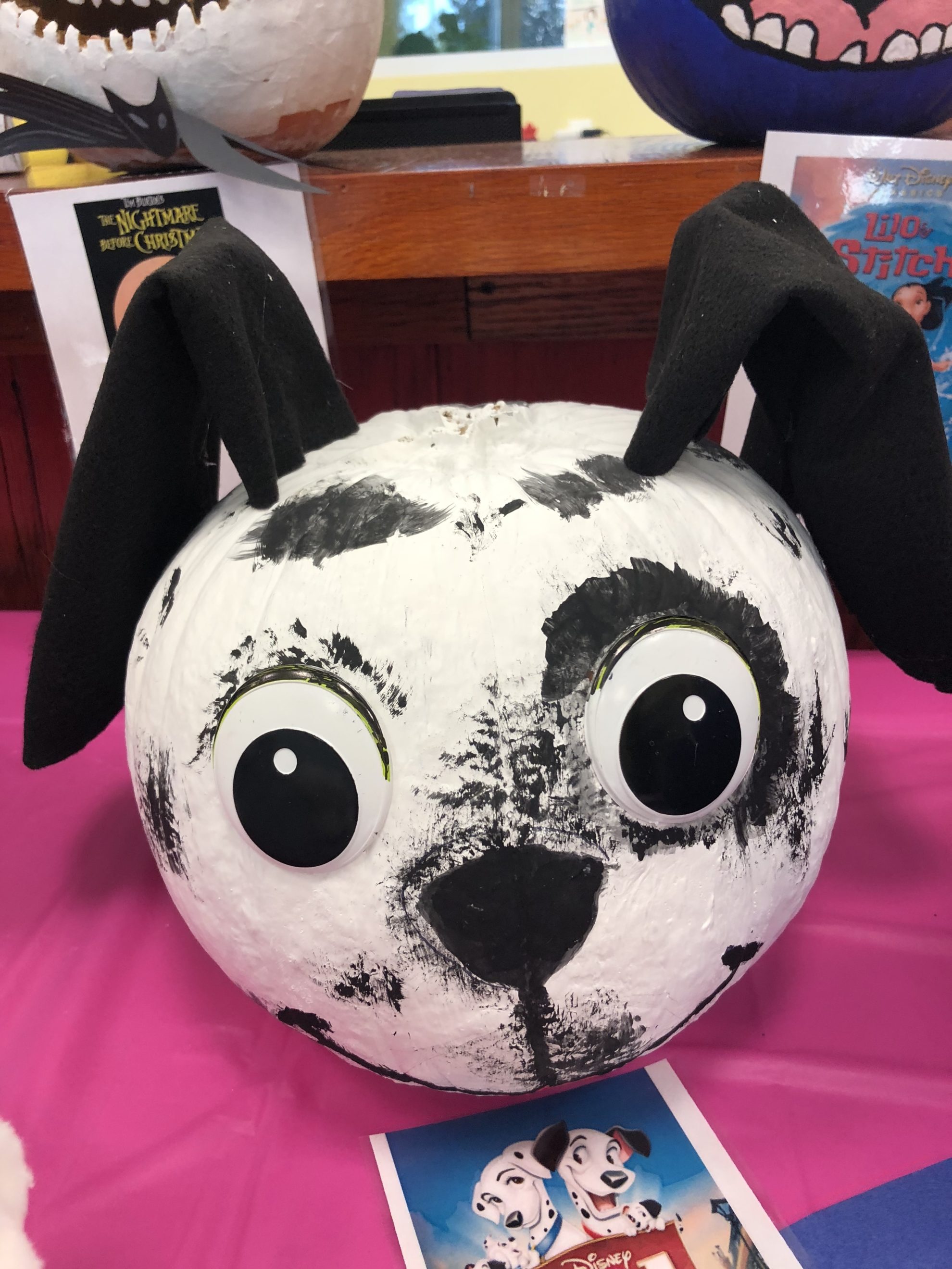 Painted Dalmatian pumpkin with black felt ears.