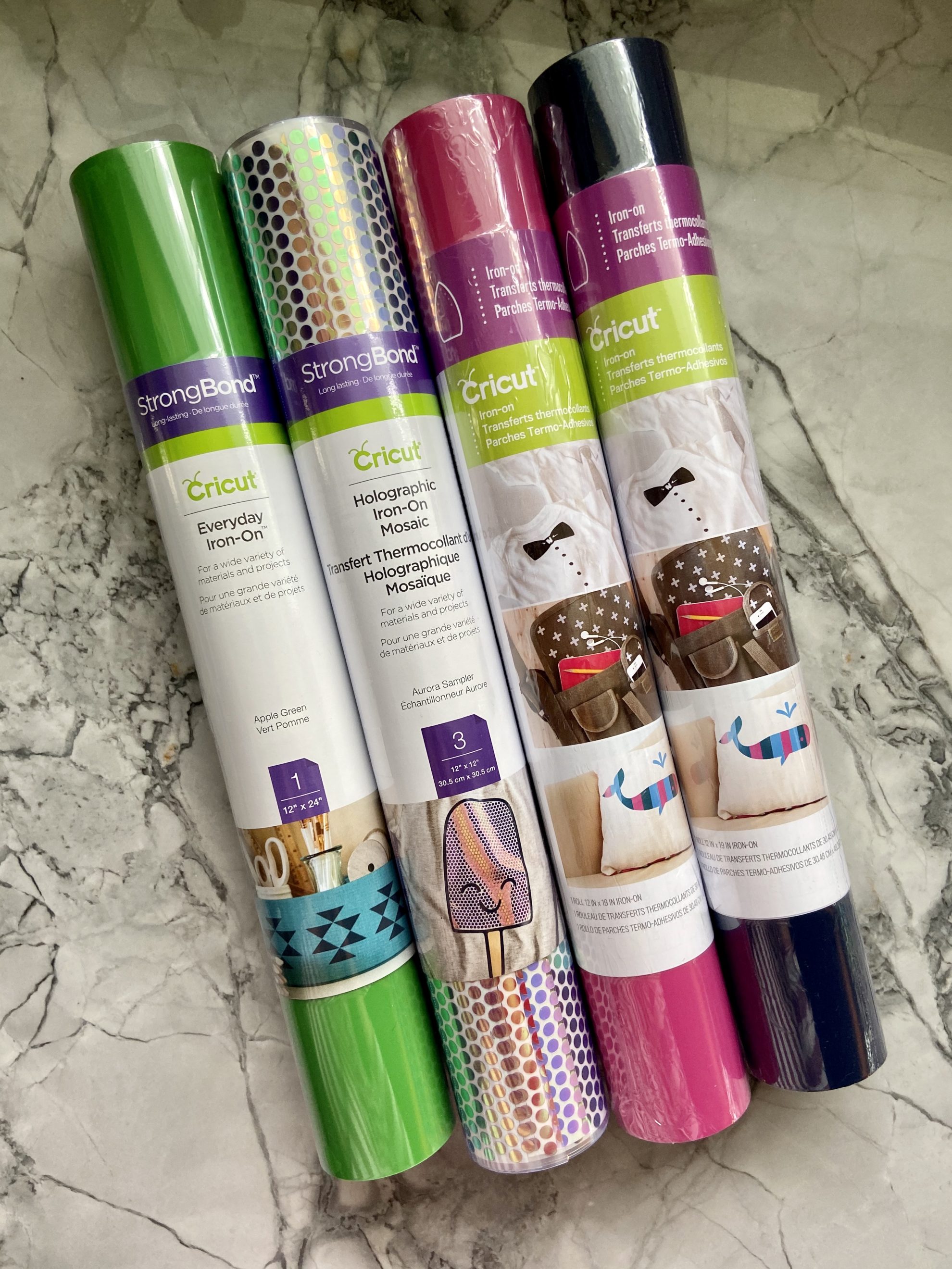 Four different rolls of Cricut Iron-On Vinyl.