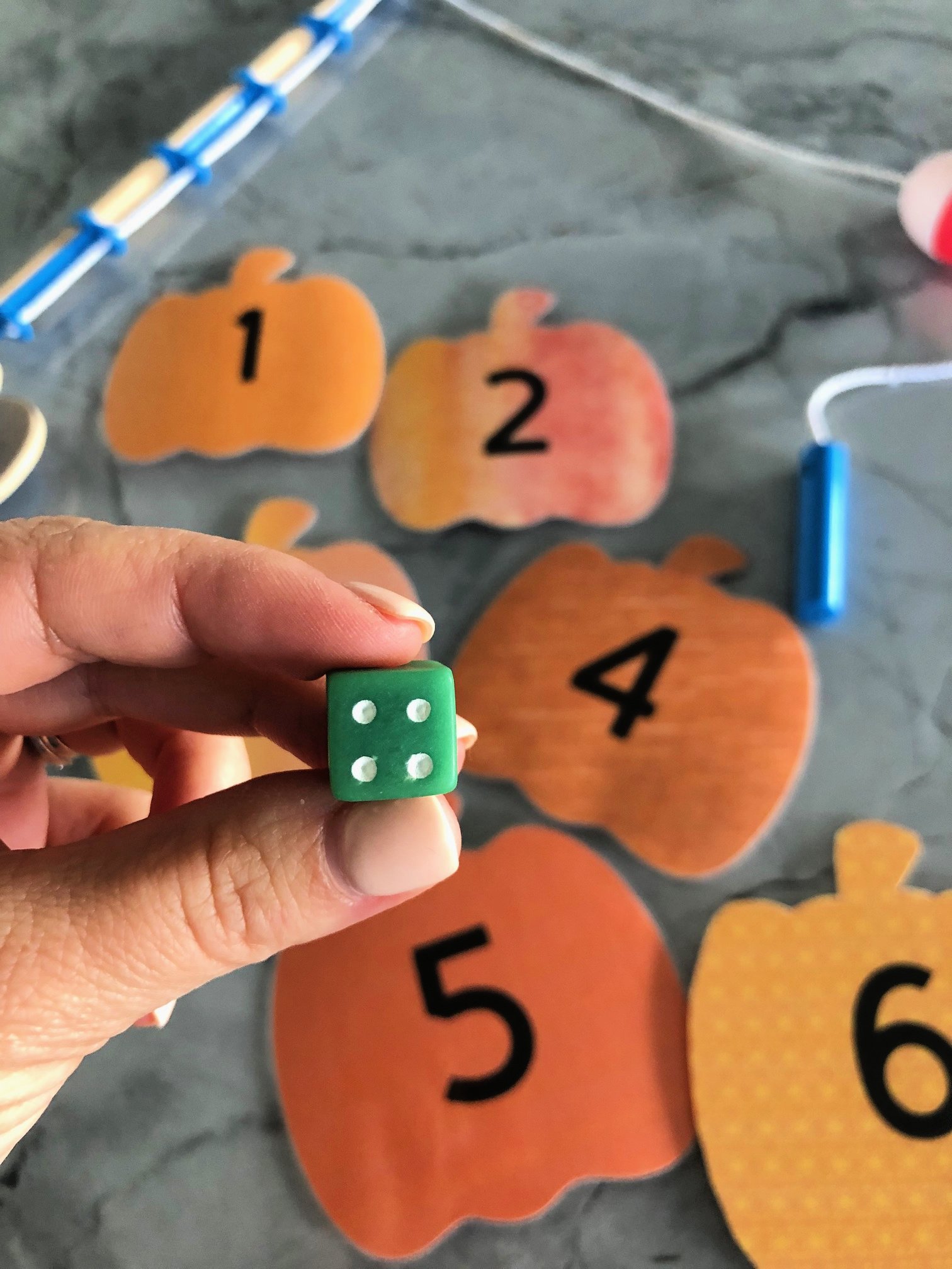 DIY Fishing for Numbered Pumpkins Game using a dice!