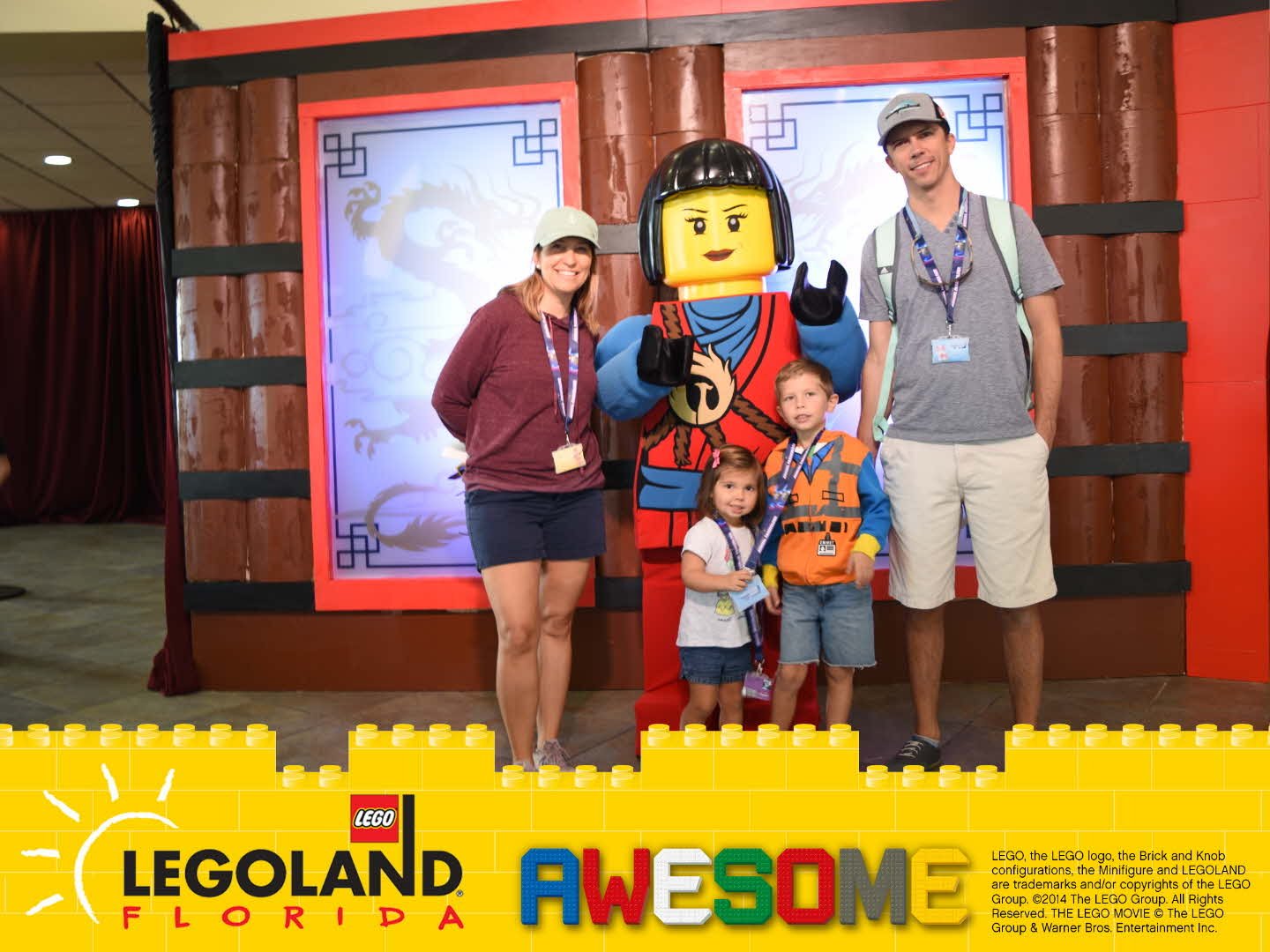 Family with Ninjago Character and legoland florida frame around photo.