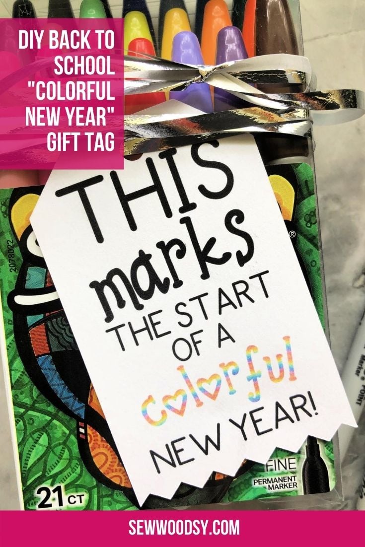 Close up of a tag that reads "this marks the start of a colorful new year!".