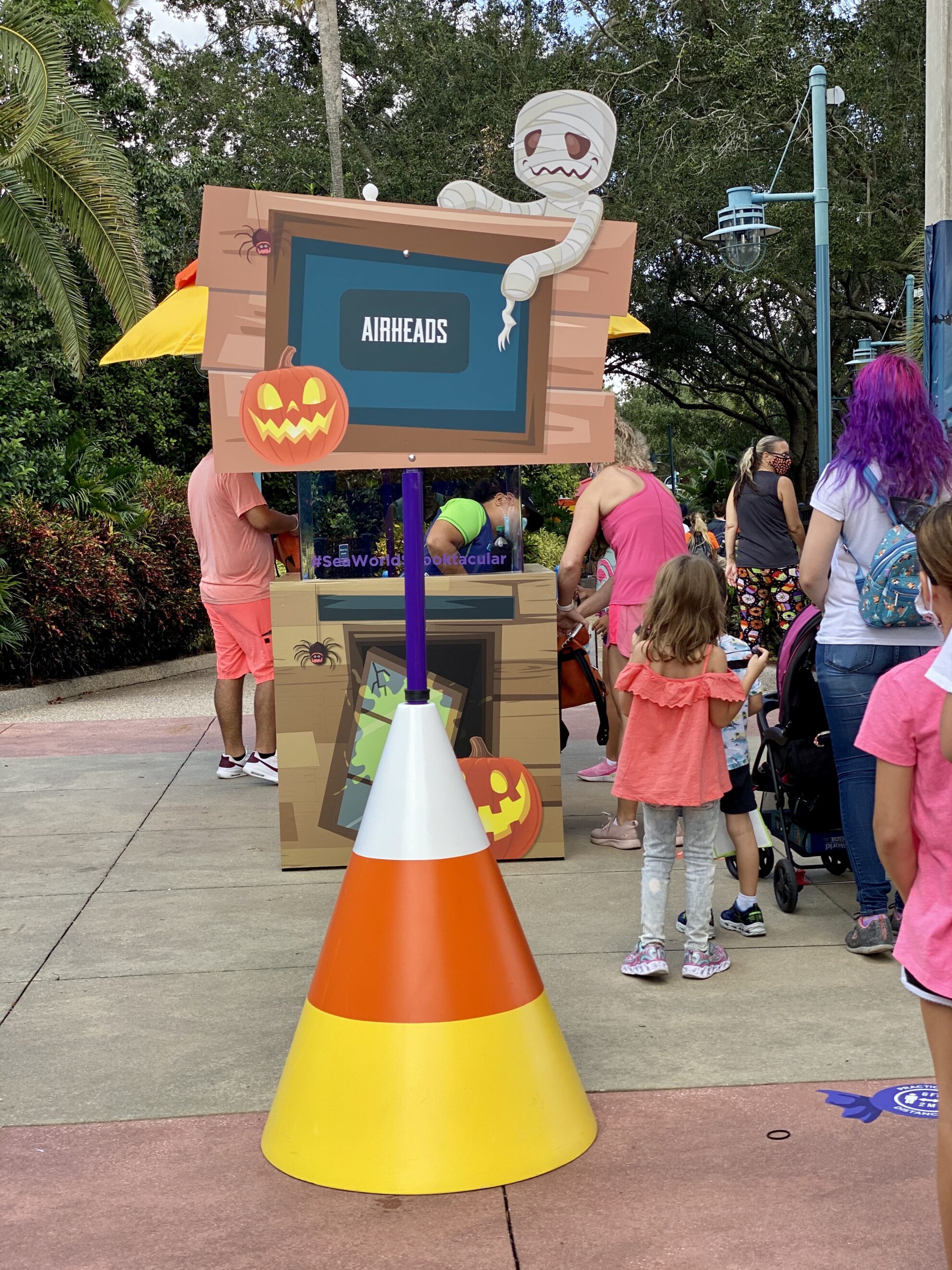 Candycorn large cone with sign that reads "airheads" at Trick or Treat station SeaWorld.