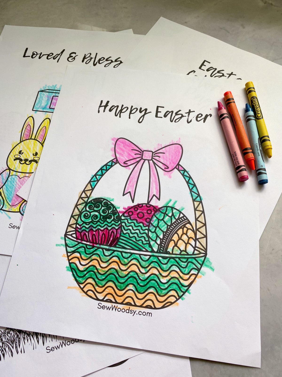 Close up of an easter basket coloring page with crayons.