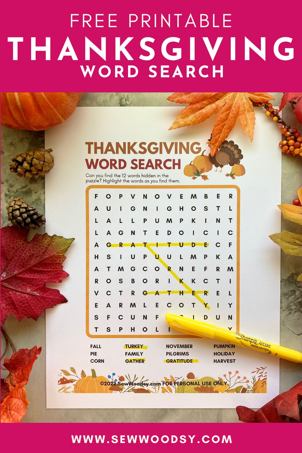 Printable word search on a white paper sitting on a marble countertop with leaves around it and text on image for Pinterest.