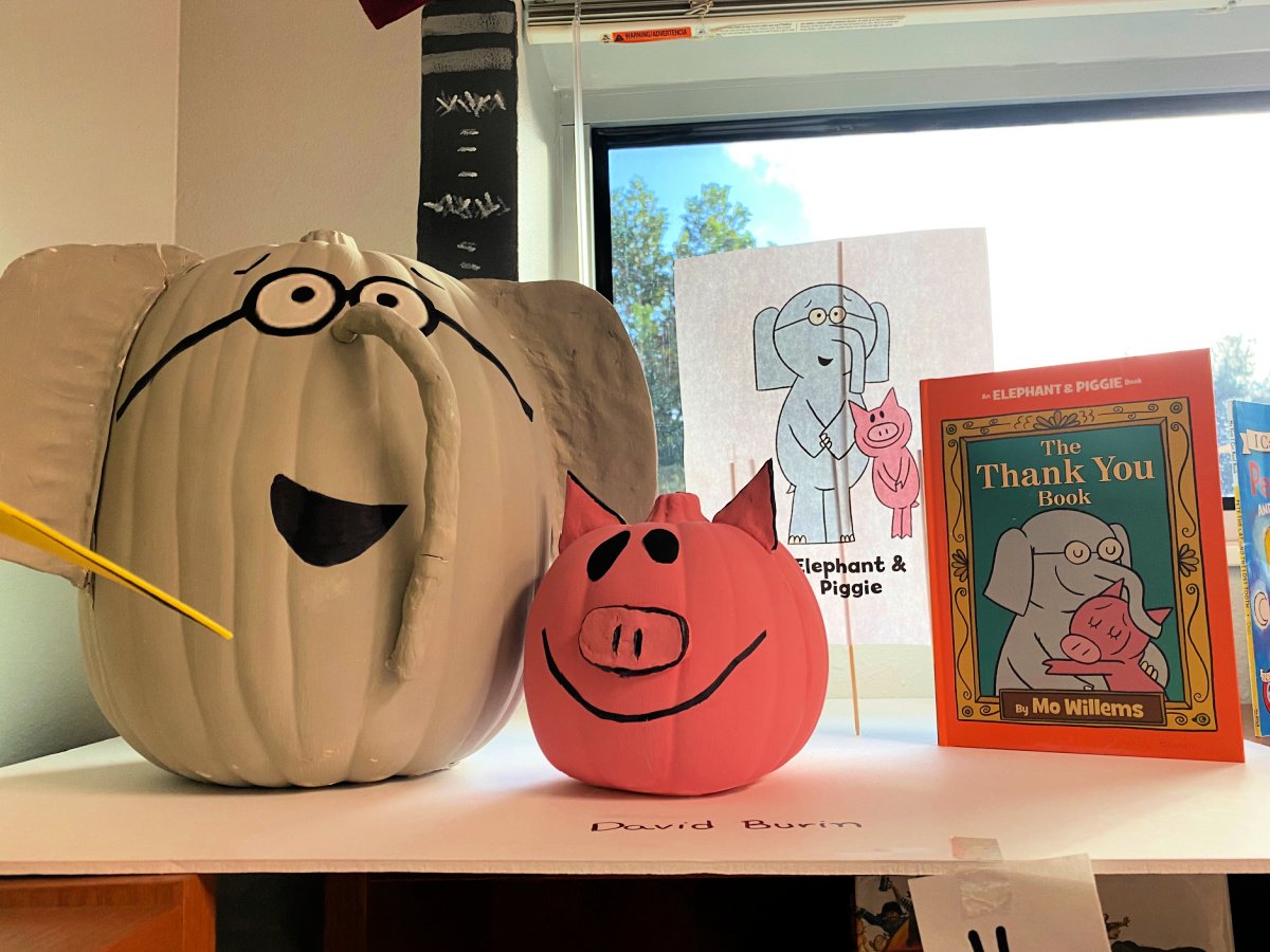 Grey elephant pumpkin and pink pig pumpkin next to a book called "The Thank You Book".